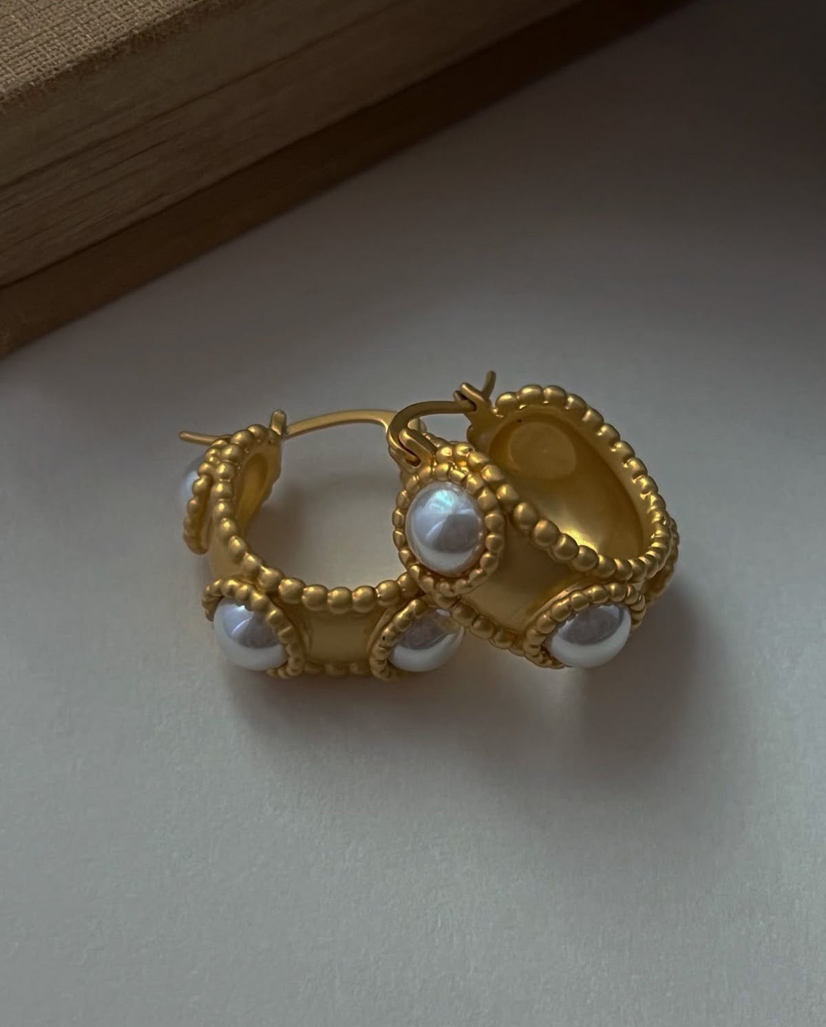 Raw product photo - pearl earrings